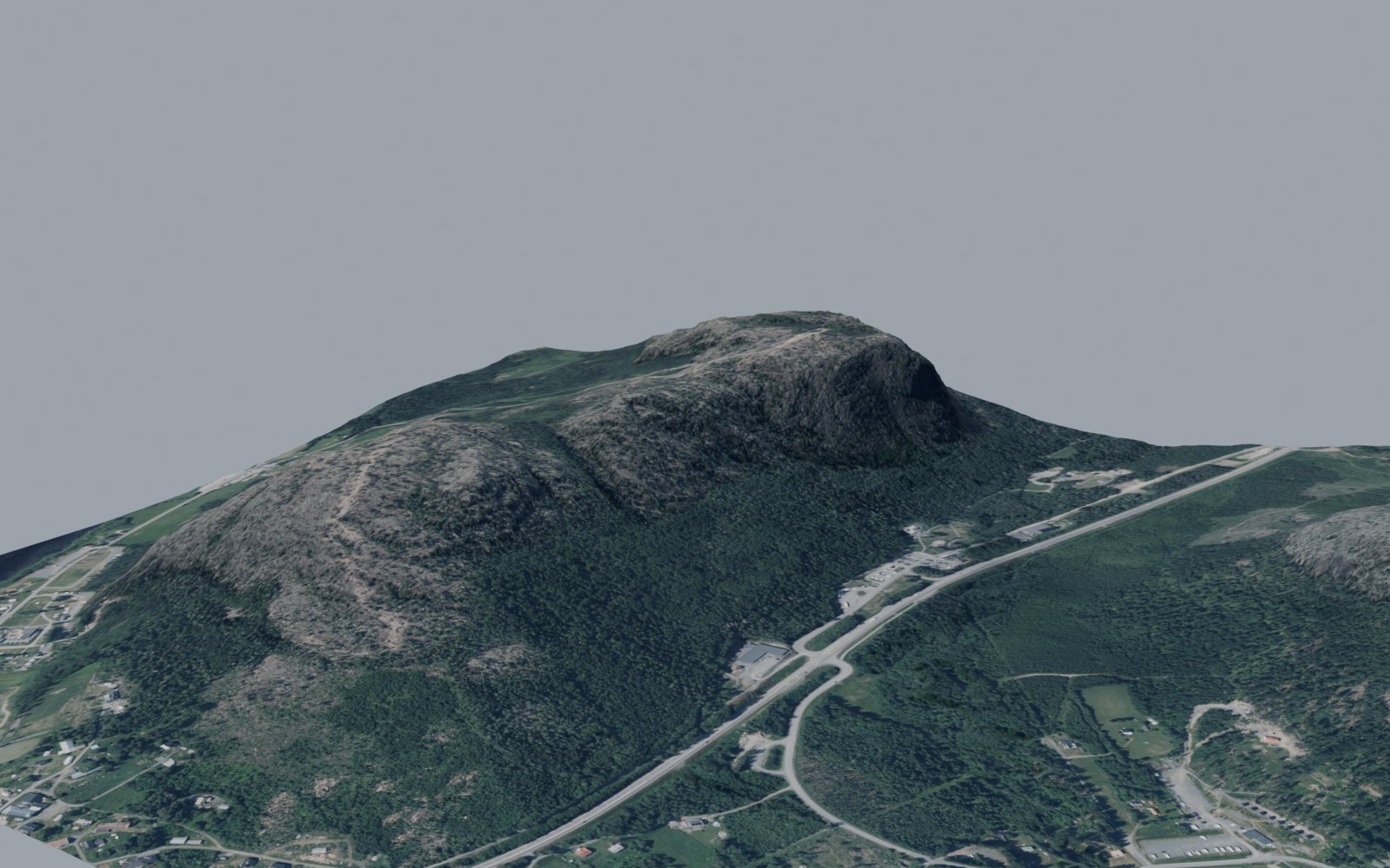Skuleberget i 3D: berget, E4:an och bebyggelsen med flygfoto som textur på laserskannad terräng.